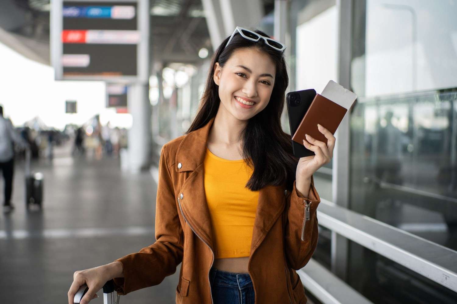 Happy Young Asian Woman Traveler Holding Passport