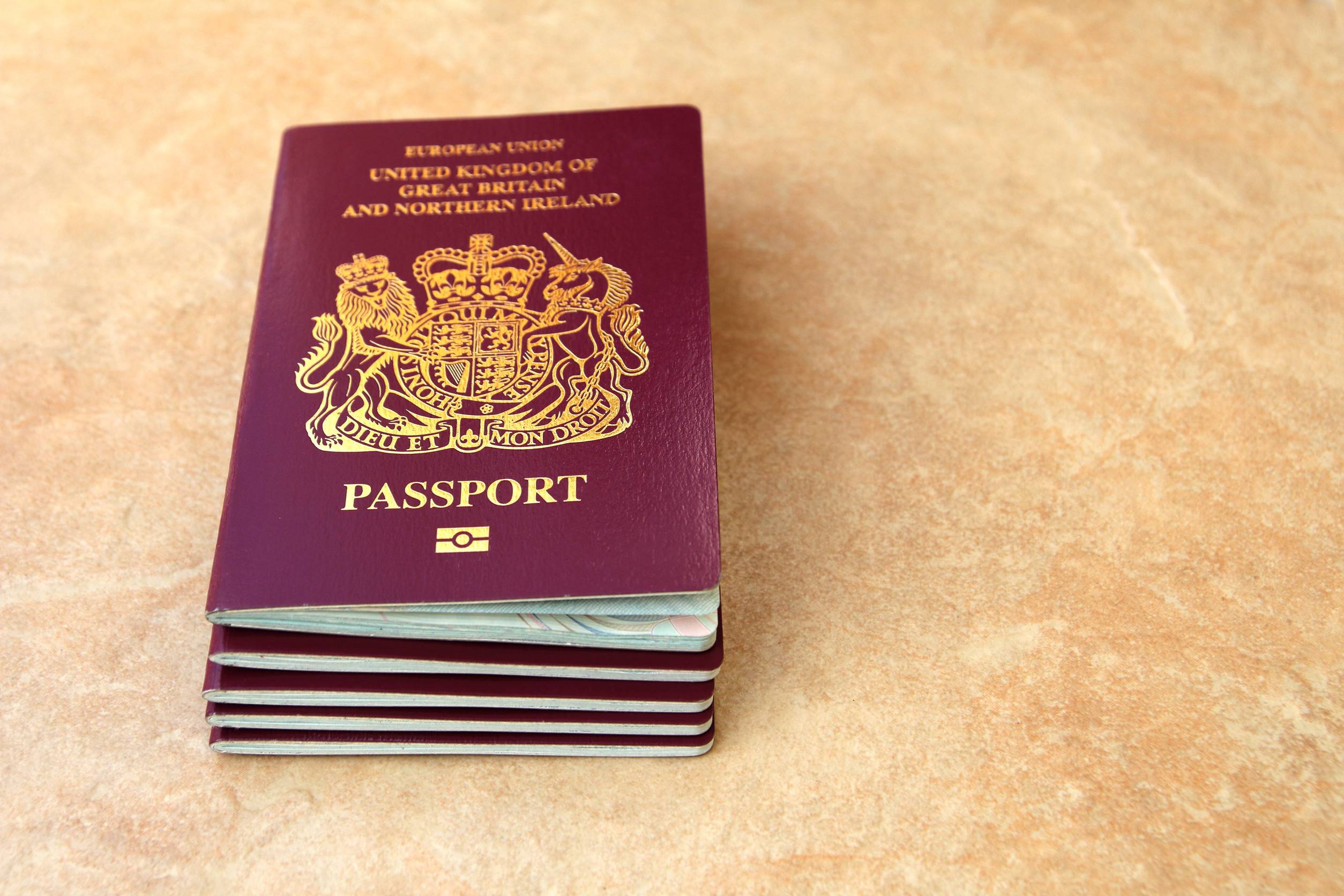 Stack of British passports on the table