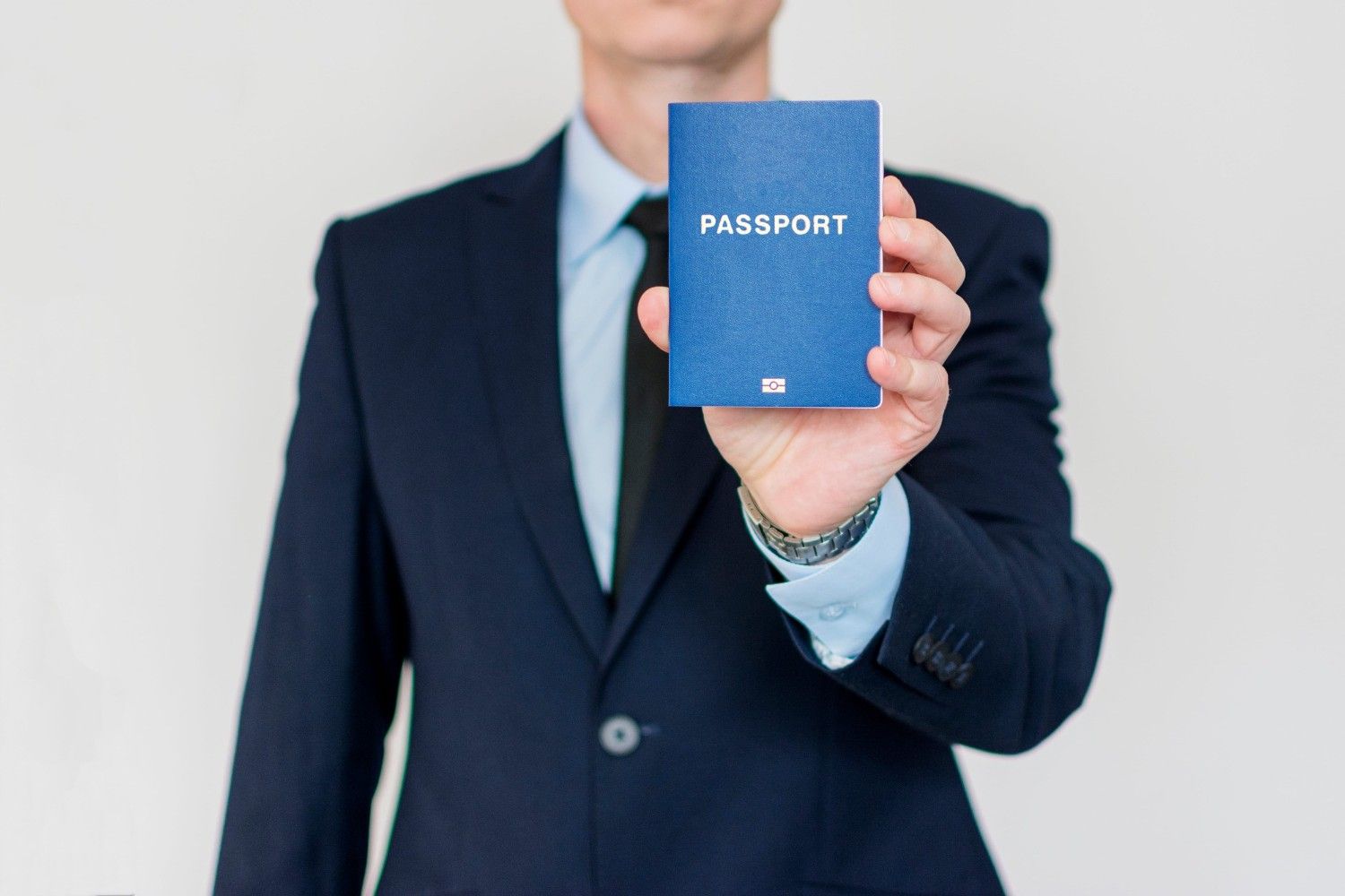 Suit Up Business Man Holding Passport